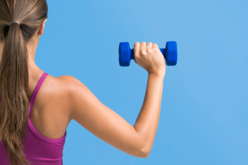 Woman exercising with dumbbells