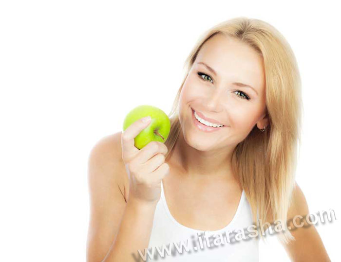 Pretty girl eating apple