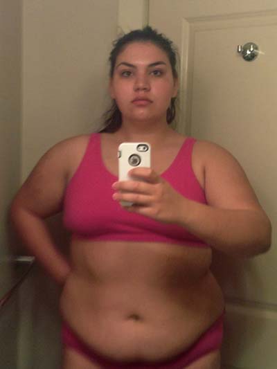PIC BY IRON GIANTESS / CATERS NEWS - (PICTURED: Laura Micetich before weight loss in 2014) - A stunning woman who shrunk 115lbs after a break-up looked so unrecognisable people thought she had gone under the knife. Laura Micetich, 25, struggled with secretive binge eating and by 2014 she had ballooned to 300lbs. At six-feet and with her obese frame, Laura described herself as intimidating. After the breakdown of a four year relationship, the beautiful brunette decided to get fit. The teacher from Jackson, Tennessee, USA, initially considered weight loss surgery but when she joined a gym and watched the first few pounds fall off she realised she could do it naturally. SEE CATERS COPY