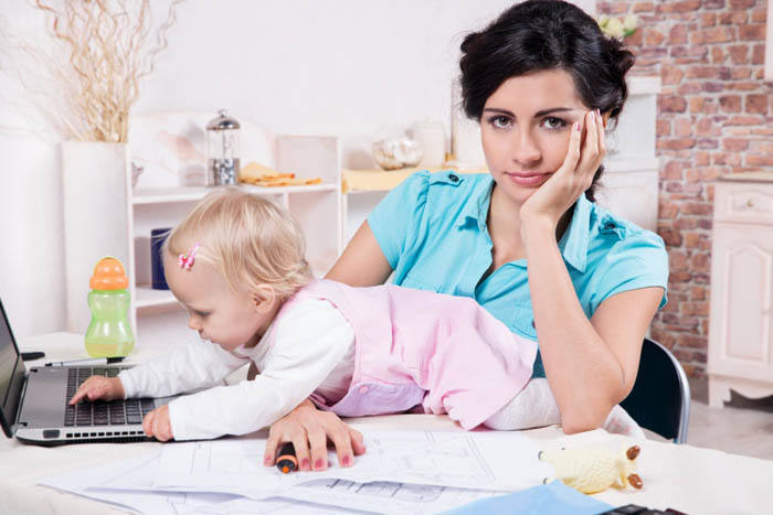 business woman with laptop and her baby girl